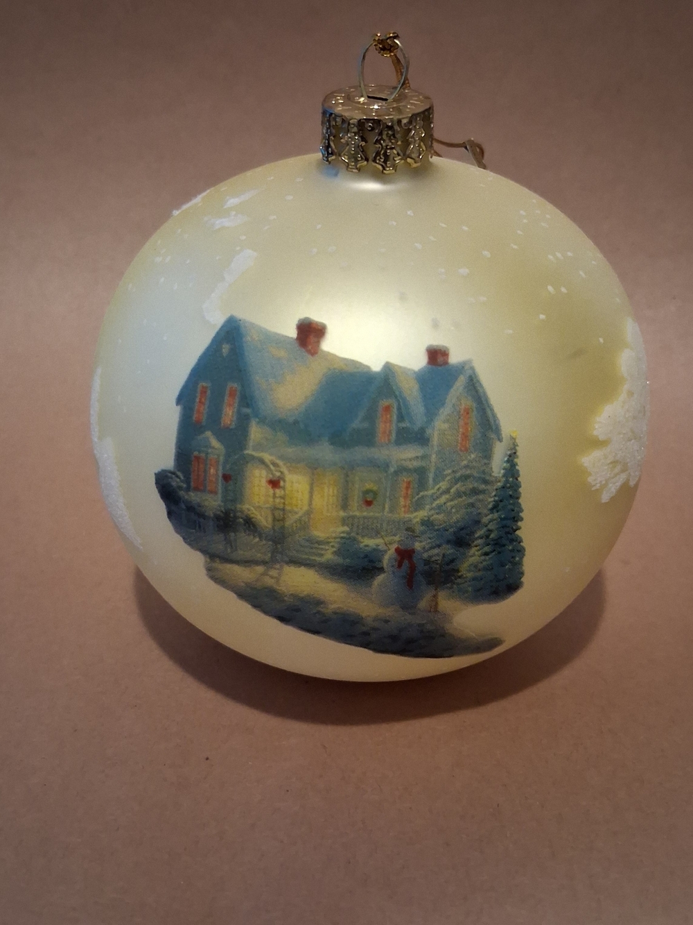 Thomas Kinkade Cream Glass Ornament with Blue Winter Cottage